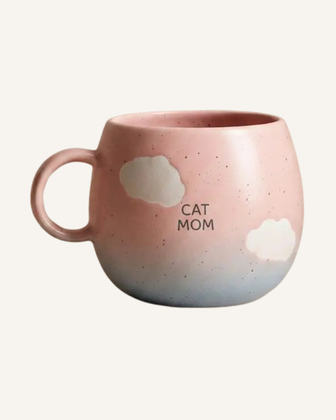 Speckled pink ceramic mug with a rounded shape, two cloud accents, and “CAT MOM” lettering.