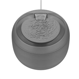 Matte black round pet water fountain with textured water cascade and ribbed outer edge.