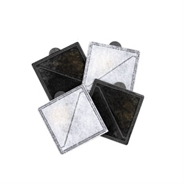 Four square carbon resin filters in black and white with textured surfaces, designed for pet drinking fountains.