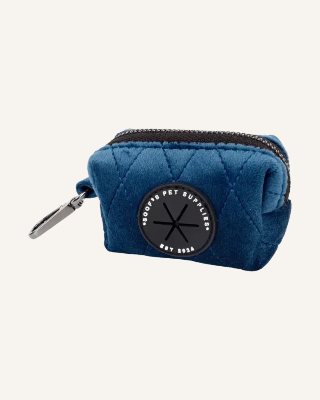 Cobalt blue velvet dog waste bag holder with a quilted pouch, black zipper, and silver clasp.