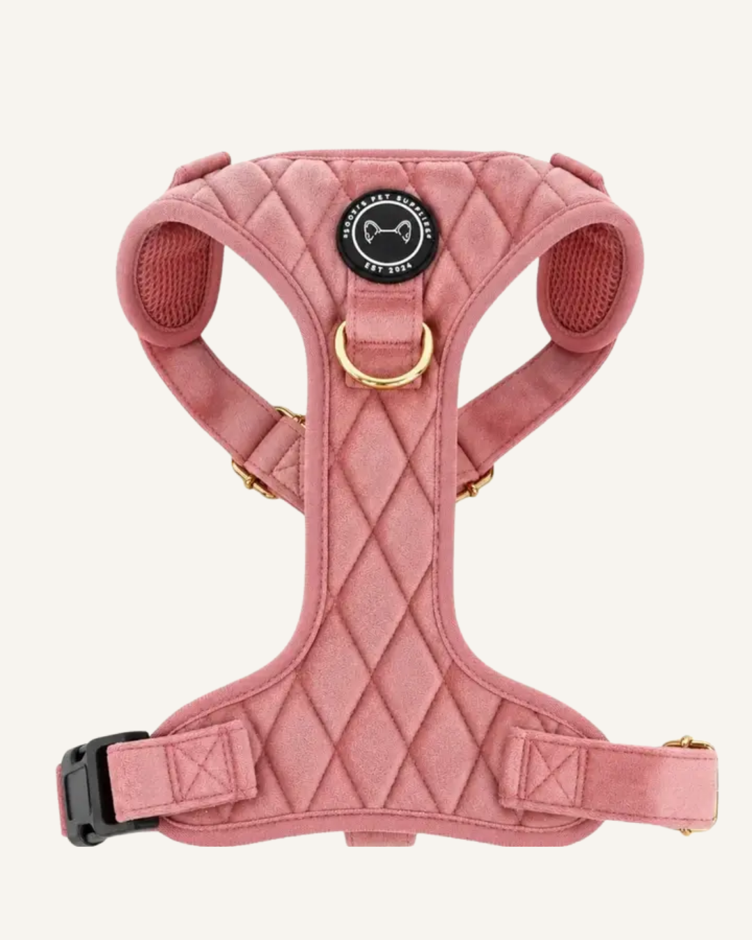 Pink quilted velvet Y-shaped dog harness with adjustable straps, black buckle, and gold-tone leash ring.